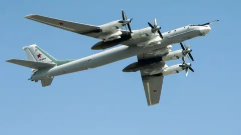 Getty Images A Tupolev Tu-95MS strategic bomber rehearses for a Moscow Victory Day parade in 2018