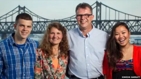 SIMEON GARRATT Photo of the Garratt family in front of the bridge linking China and North Korea