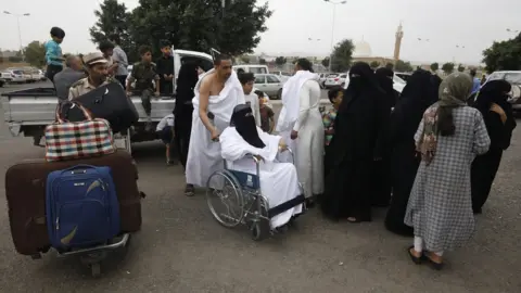 EPA Yemeni Muslims arrive at Sanaa's airport before flying to Saudi Arabia for the Hajj pilgrimage, in Sanaa, Yemen (17 June 2023)