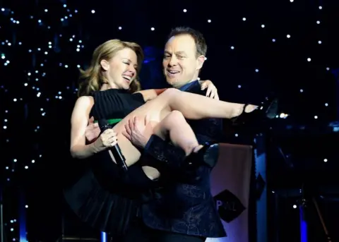 PA Kylie Minogue and Jason Donovan perform during the Hit Factory Live Christmas Cracker concert, at the O2 arena in London on 21 December 2012