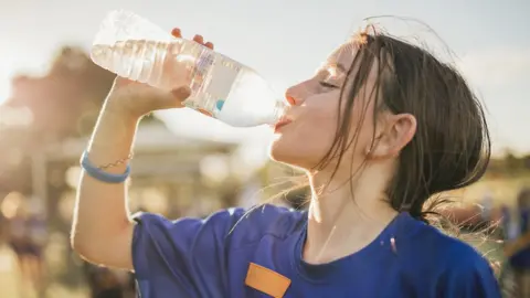 Getty Images Child drinking water