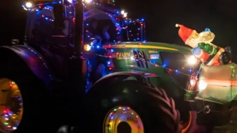 An illuminated tractor