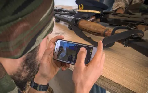 AFP A fighter loyal to the internationally-recognised Government of National Accord (GNA) play online video game PlayerUnknown"s Battlegrounds (PUBG) on their phones during a break from fighting, in a military base in Tajoura, south of the Libyan capital Tripoli on May 1,