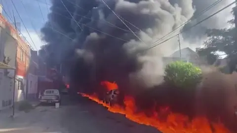 A huge fire and clouds of smoke in a residential area in Mexico