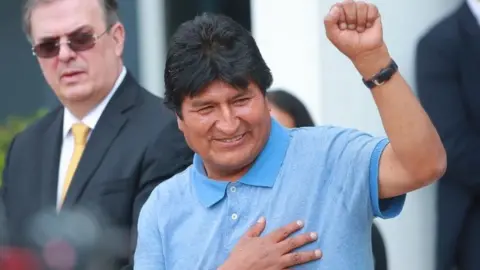 Getty Images Evo Morales arrives at Benito Juarez International Airport after accepting the political asylum in Mexico