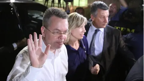 Reuters Mr Brunson and his wife at the airport in Izmir