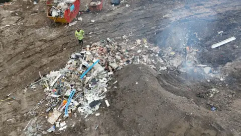 An aerial shot of waste being burned