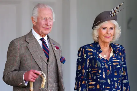  (EMBARGOED FOR PUBLICATION IN UK NEWSPAPERS UNTIL 24 HOURS AFTER CREATE DATE AND TIME) King Charles III (wearing a Royal Marines tie) and Queen Camilla be  The Braemar Gathering 2024.