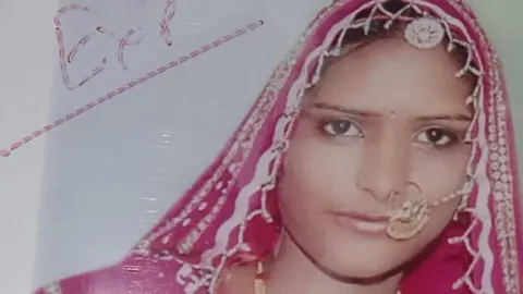 BBC Lakshmi dressed in pink coloured bridal finery at her wedding in 2016