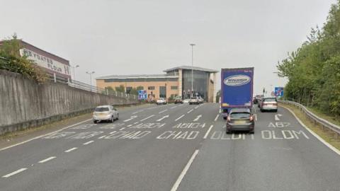 Cars and a lorry drive up the slip road at Junction 22 of the M60