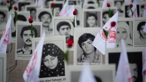 AFP Around 800 portraits of executed prisoners are displayed by representatives in France of the People's Mujahedin of Iran in Paris on October 29, 2019