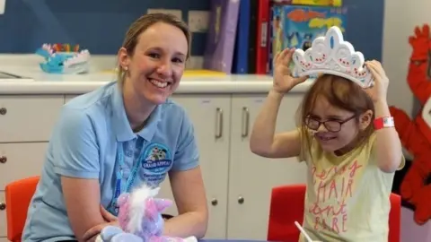 Grand Appeal Kara in recovery with play specialist at Starlight Ward, Bristol Children’s Hospital