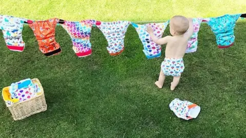 Cecilia Leslie / Instagram Baby hanging nappies on a clothes line