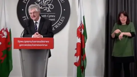 Welsh Government Cathryn McShane interpreting for First Minister Mark Drakeford at a daily briefing