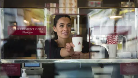 Ben Stevens / Parsons Media Pret barista serving coffee