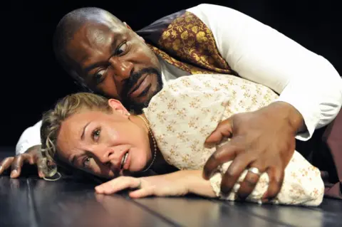 Getty Images Lenny Henry as Othello and Jessica Harris as Desdemona in William Shakespeare's Othello at the Trafalgar Studios in London