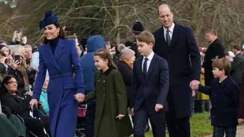 PA Media The Prince and Princess of Wales with their three children George, Charlotte and Louis