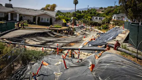 Debris flow and mudslide damage in a California neighborhood