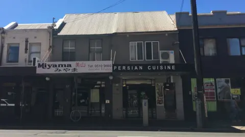An external view of a flat above a restaurant where two bodies were found