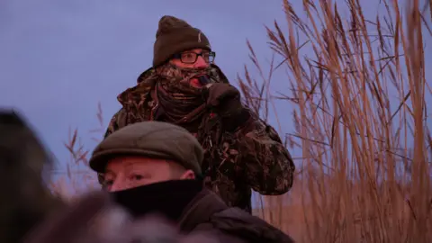 BBC hunter blowing a whistle