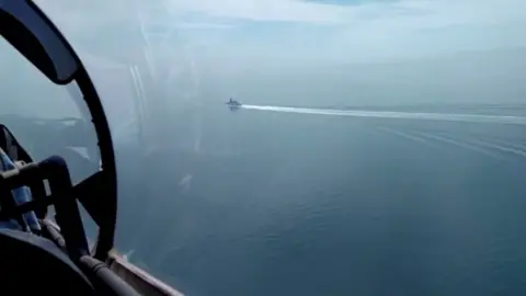 Reuters a video released by Russia"s Defence Ministry allegedly shows the HMS Defender