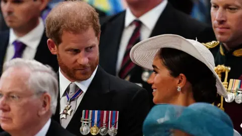 Getty Images Prince Harry, Duke of Sussex, and Britain's Meghan, Duchess of Sussex