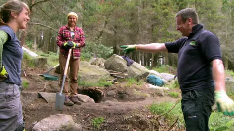 Workers repairing the Glen River path