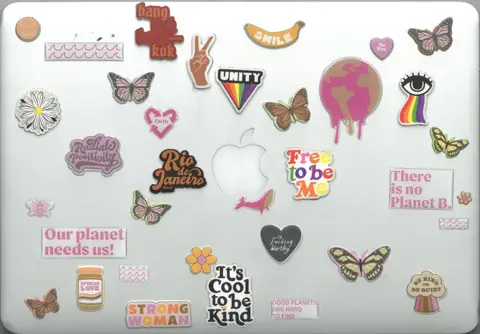 Thorsten Mjölnir Laptop with many stickers, including environmental issues