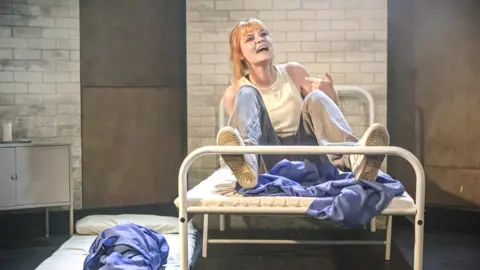 Craig Fuller An actress on stage performing in Circuit Breaker