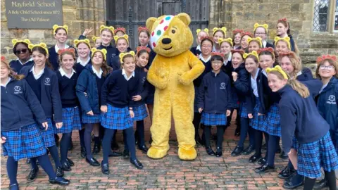 Pudsey bear with schoolchildren at Mayfield School, East Sussex