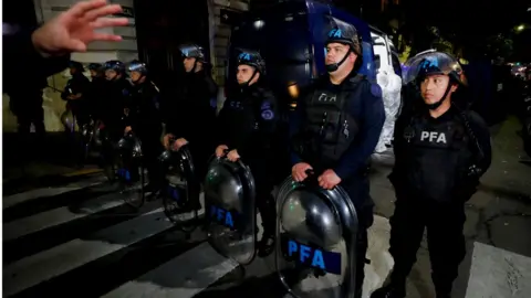 Reuters Police officers stand guard as forensics work is carried out following the attempted shooting