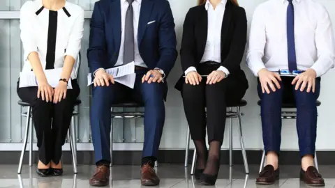 Getty Images People waiting for a job interview