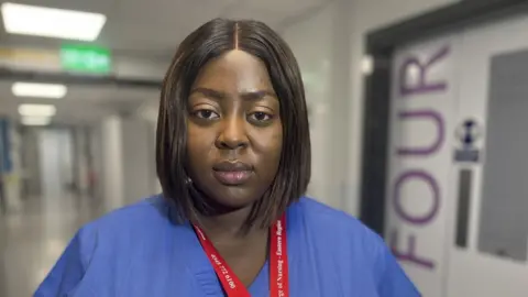 Nikki Fox/BBC Beth Aghahyowa, an emergency surgery nurse at West Suffolk Hospital