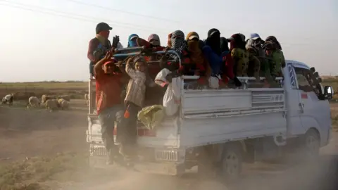 Reuters Residents displaced by fighting between Syrian Democratic Forces and Islamic State militants ride on a truck near Raqqa