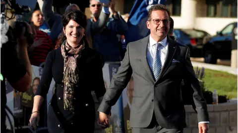 Reuters Bloc Québécois leader Yves-Francois Blanchet, accompanied by his wife, arrives for the federal election debate