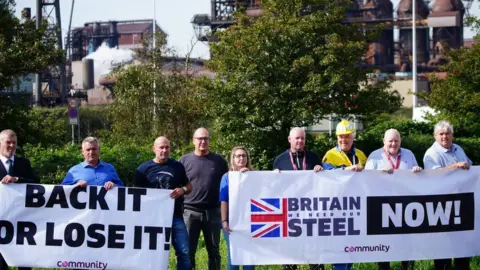 PA Media Workers outside Tata Steel's Port Talbot steelworks in south Wales, as around 3,000 jobs are at risk at the plant as part of a planned restructuring.