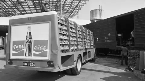 Getty Images Coca-Cola being loaded onto a train in Hong Kong in 1979