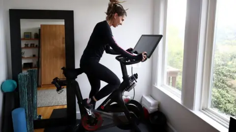 Peloton user rides bike