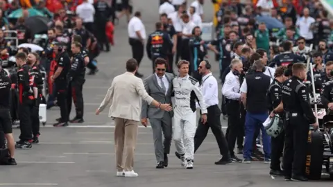 Getty Images Javier Bardem and Brad Pitt at Silverstone