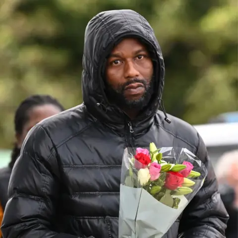 Getty Images man with flowers