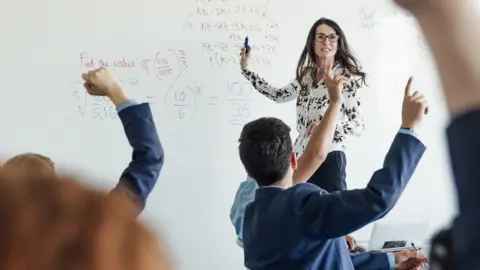 Getty Images Stock picture of teacher in front of class