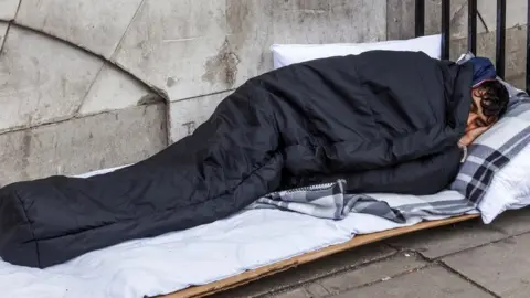 Getty Images Rough sleeper on the street