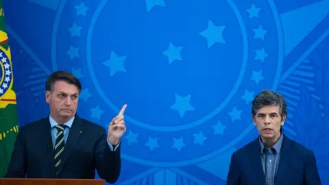 Getty Images Bolsonaro and Teich at a press conference