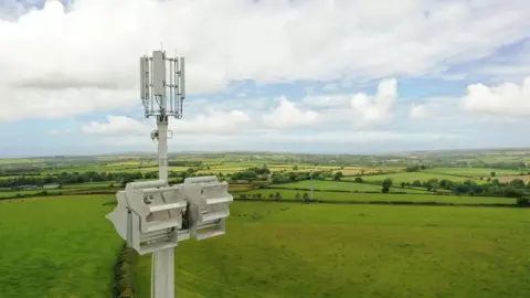 Alex Viner/Vodafone wind turbine on the top of a mobile mast