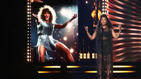 Getty Images Angela Bassett inducts Tina Turner to the Rock and Roll Hall Of Fame in 2021