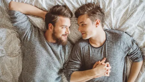 Getty Images A gay couple in bed