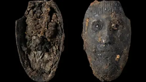 MOLA The small silver face found in the burial site