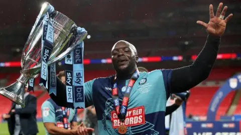 Getty Images Adebayo Akinfenwa celebrates promotion