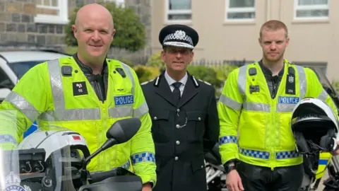 Guernsey Police PC Mat Du Port, Chief Officer Ruari Hardy, and PC Adam Potter