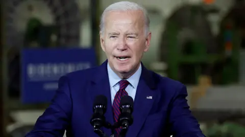 Reuters US President Joe Biden speaking at Auburn Manufacturing in Maine on 28 July